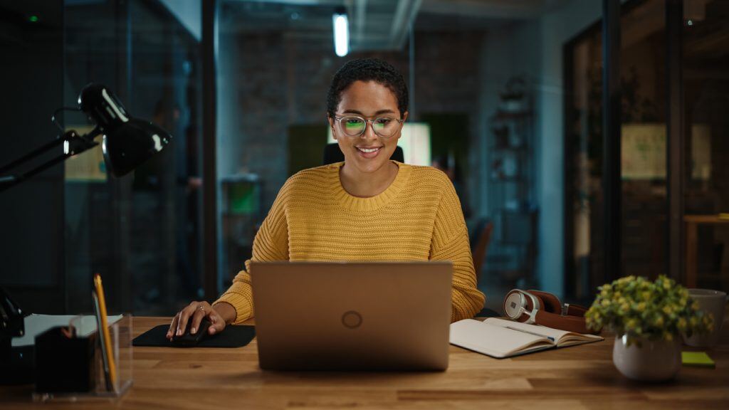 Young Latina Marketing Specialist Working on Laptop Computer