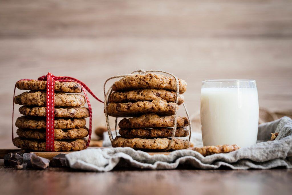 Two stacks of cookies and a glass of milk | Motif