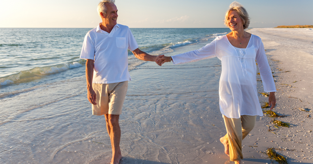 Walking on a beach is a perfect pose for couples photography.