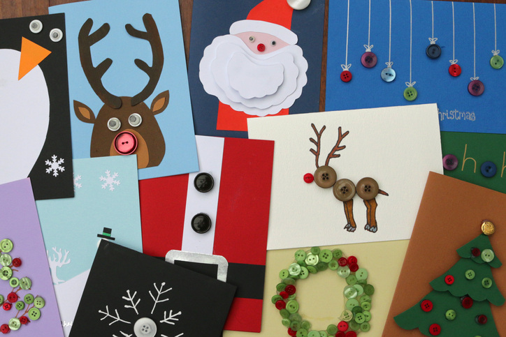 Various DIY Christmas cards in a pile to show you all the possible ideas you can create.