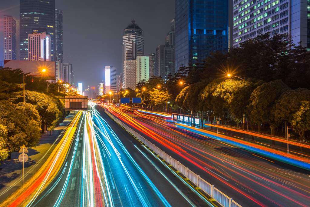 These night photography tips explain how to create streaking lights from cars on city streets.