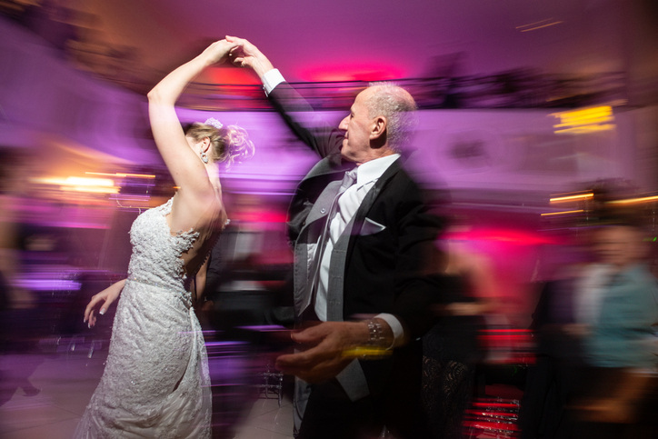 Candid wedding photos means a lot of dancing shots.