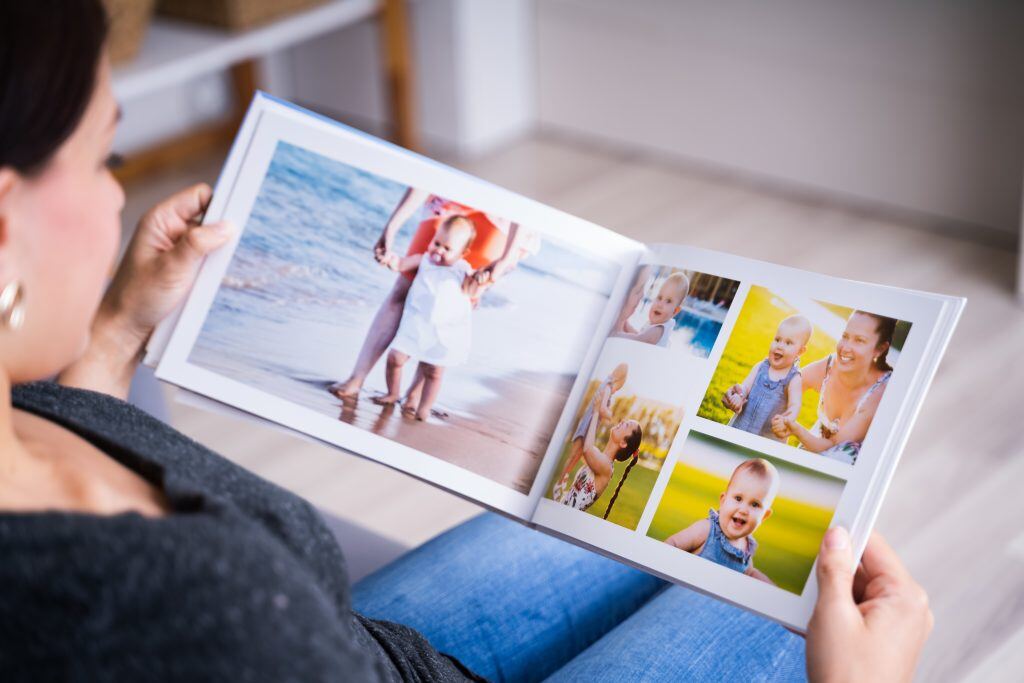 A photo book with different layouts shown.