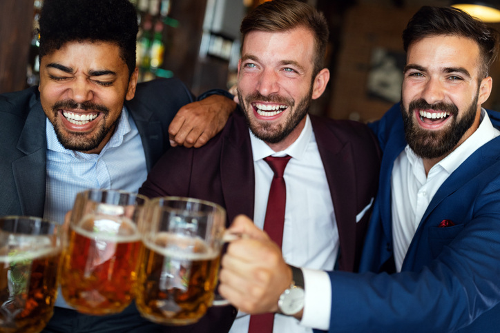 DIY Christmas gift idea: a photo book for men coworkers who go to happy hour in their suits.