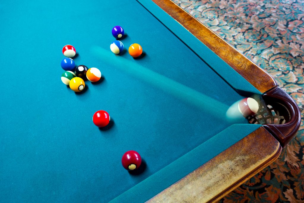 An example of rear curtain flash sync on a pool table.