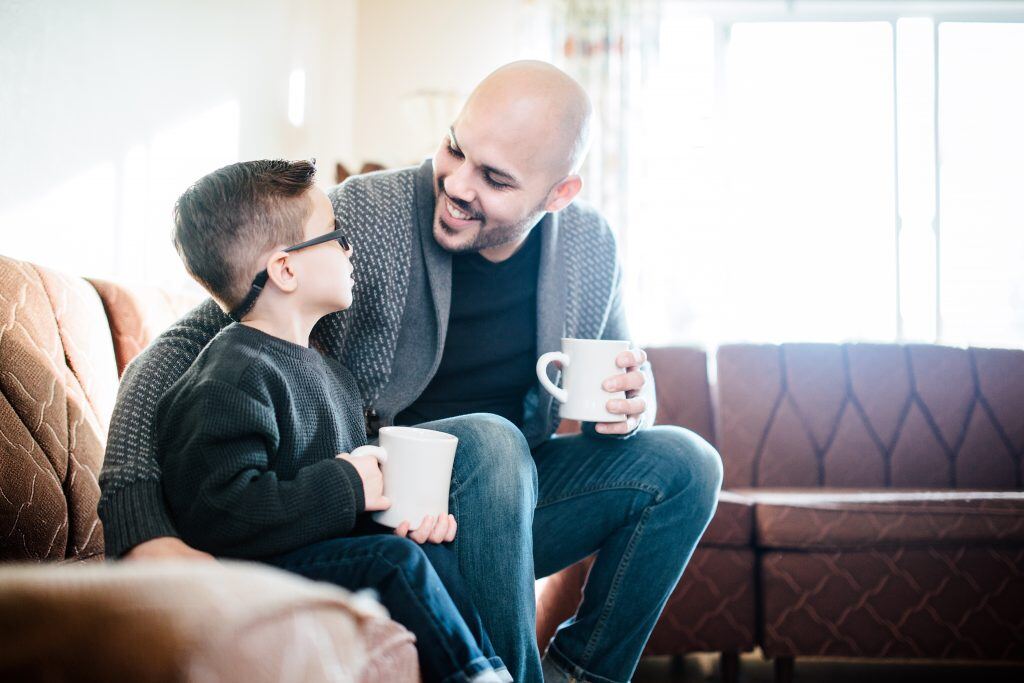 Include a pic of Dad drinking coffee with his son in your Father’s Day photo book.