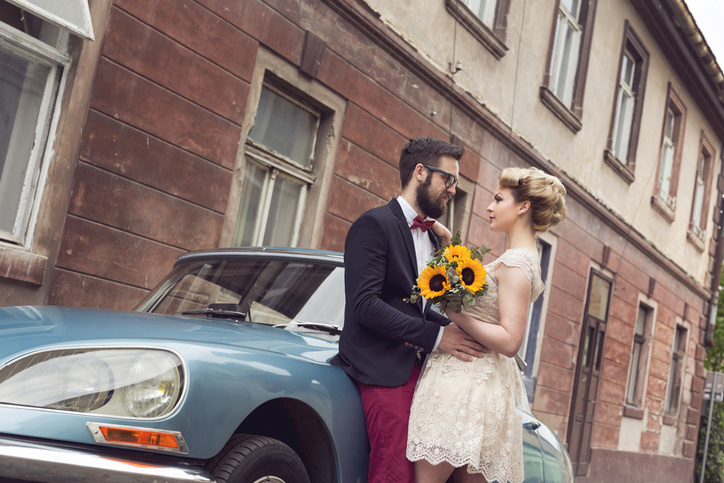 A couple bring a vintage vibe to their engagement photoshoot.