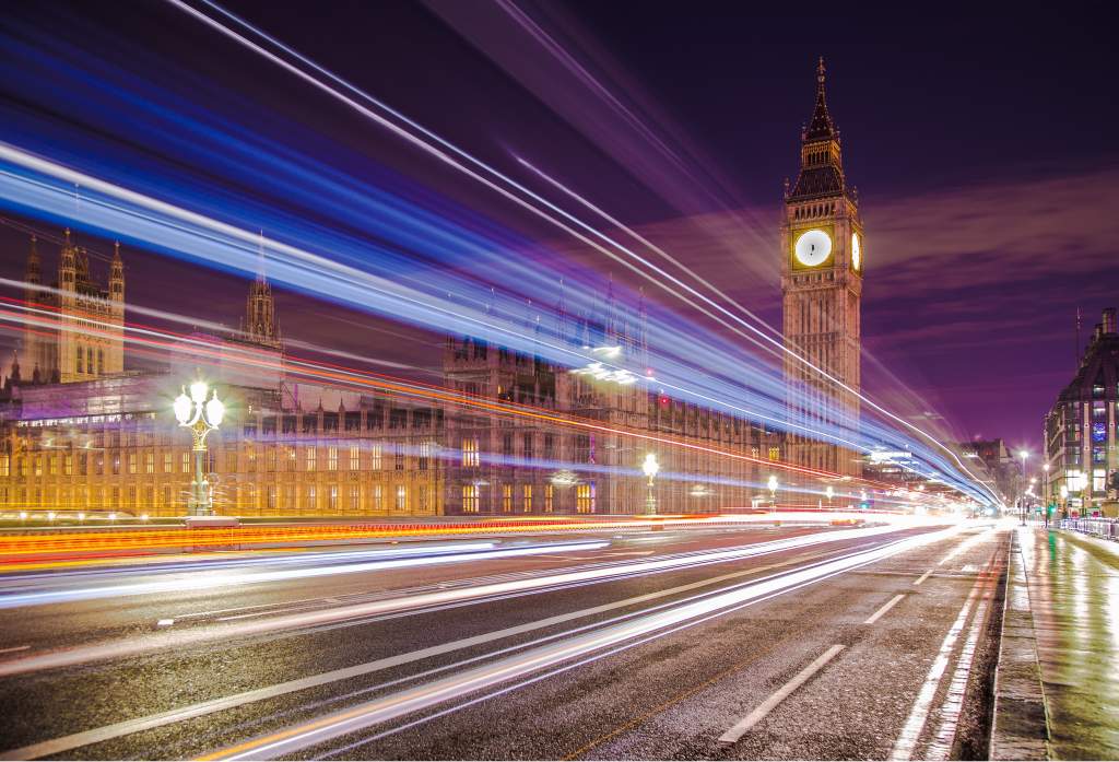 Use these night photography tips to capture streaking car lights on street in front of Big Ben.